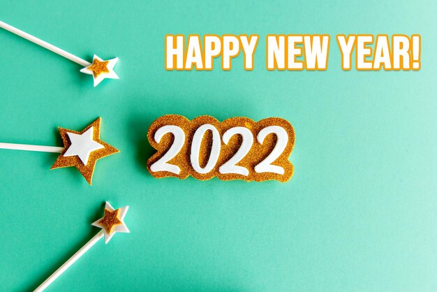 2022 on green background with stars, new year concept