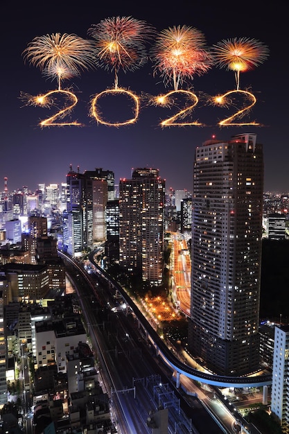 2022 happy new year fireworks celebrating over Tokyo cityscape at night, Japan