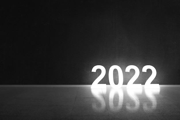 2022 met zwarte muurachtergrond. Gelukkig nieuwjaar 2022