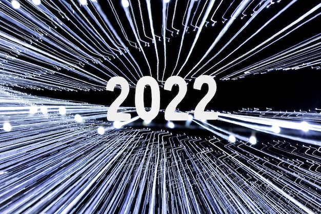 2022 nieuwjaarskaart met lichtstralen achtergrond gemaakt door slingers