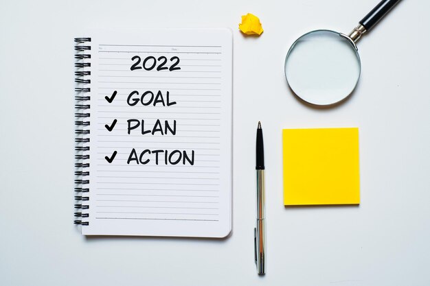 2022 resolutions, goals plans in life, business, close up of man writing and preparing for new year 2022