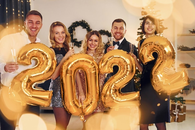 2022 year Group of people have a new year party indoors together