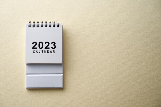 2023 desk calendar on color background