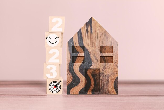 2023 Numbers And Smiley Face Icon With Goal To Have A Home Of Their Own On Wooden Cube