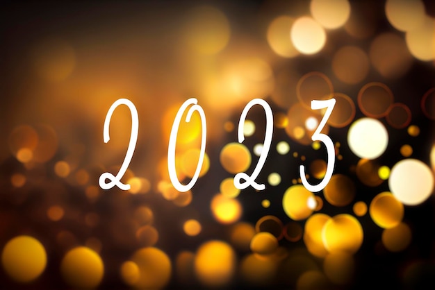 Photo 2023 text and defocused background with golden bokeh lights