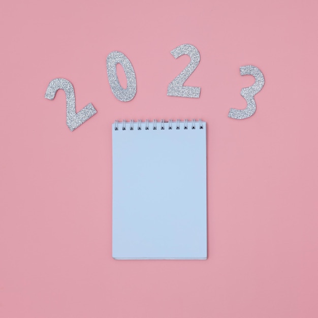 2023 text with blank note for to do list isolated on pink background.