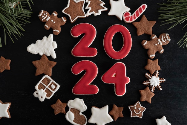 2024 from ginger biscuits glazed sugar icing Christmas cookies stars firtree and other