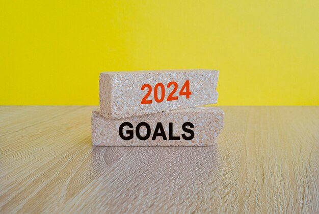2024 goals word on brick blocks beautiful wooden table yellow background
