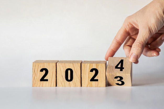 2024 Happy New Year eve wooden blocks flip change hand countdown starting ending 2023 action sched