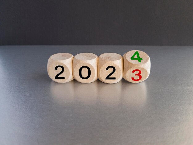 2024 happy new year symbol Wooden cubes symbolize the change from 2023 to the new year 2024