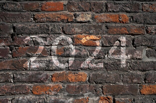 Photo 2024 new year white text written on the old brick wall