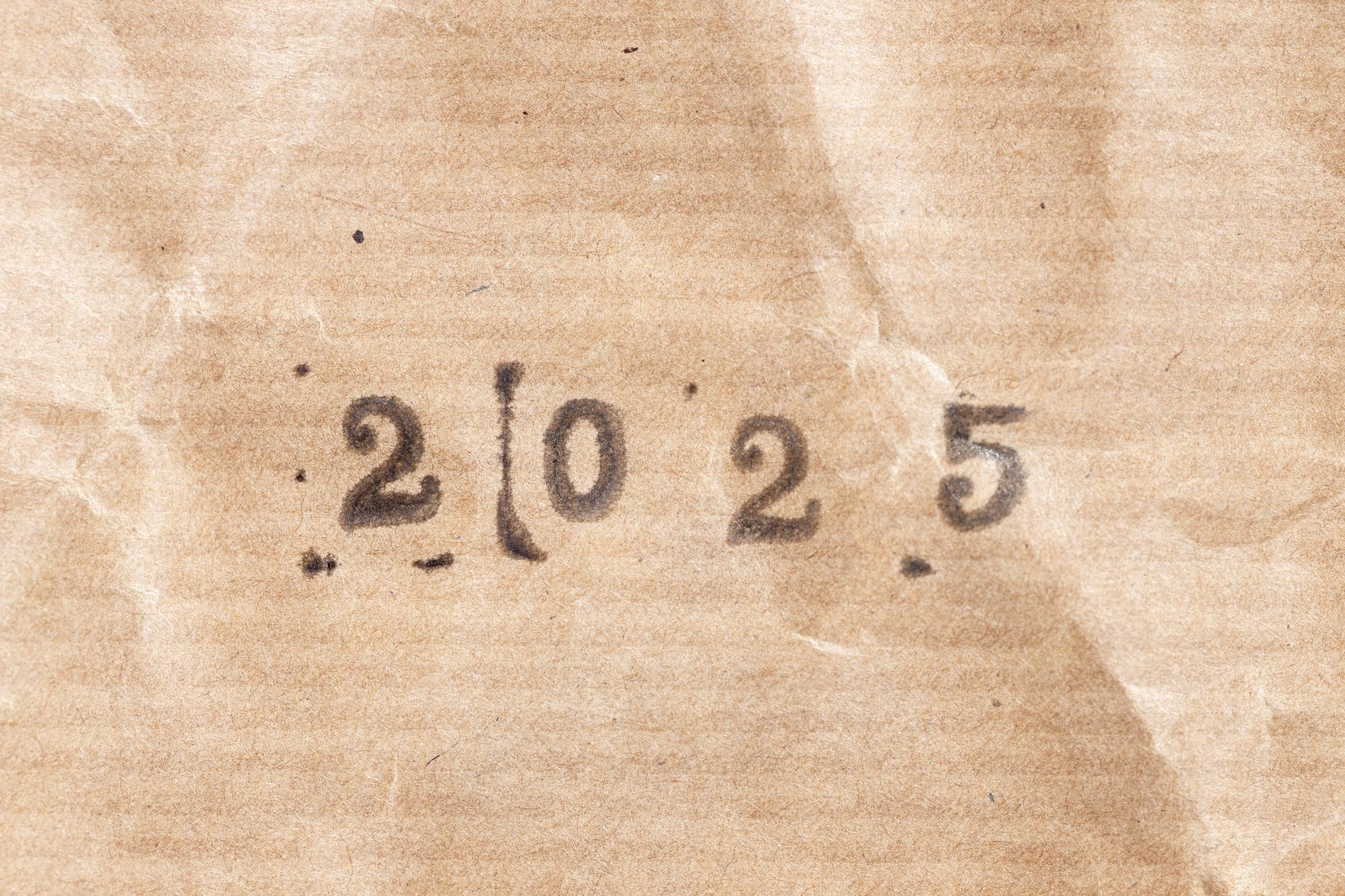 Premium Photo 2025 ink rubber stamp on crumpled brown paper