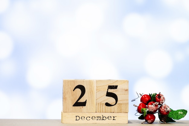 25 december and christmas decoration on blue background