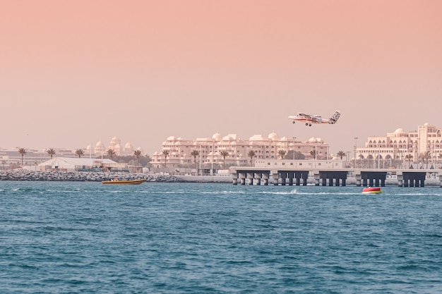 25 February 2021 Dubai UAE A skydive light propeller plane takes off from the sea air strip to gain altitude and drop parachutists