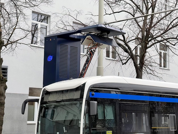 26022023 Gdynia Trojmiasto Poland Europe Blue electric bus at a stop is being charged by pantograph
