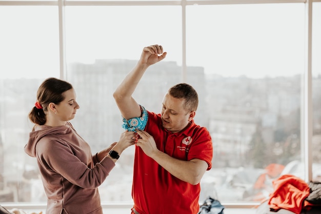 26032022 Kyiv Ukraine Training on emergency medical care was conducted by a Red Cross instructor in the office space for the civilian population of Ukraine due to the military attack on Russia