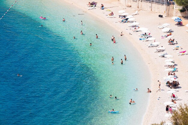 27 august 2021 kalkan turkey vacationers sunbathe and swim on the public beach of the kalkan resort