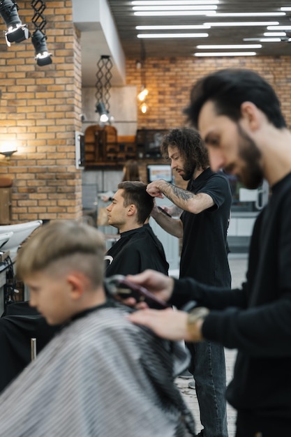 281123 Vinnitsa Ukraine a modern salon for men's haircuts where men work for other men Work process of cutting hair at clients