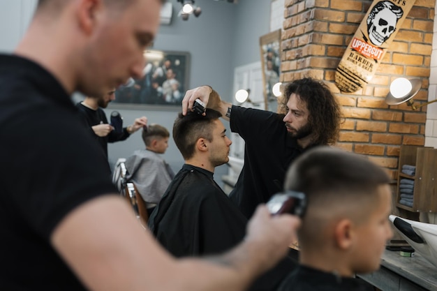 281123 Vinnitsa Ukraine a modern salon for men's haircuts where men work for other men Work process of cutting hair at clients