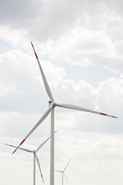 3 wind turbines on a blue sky