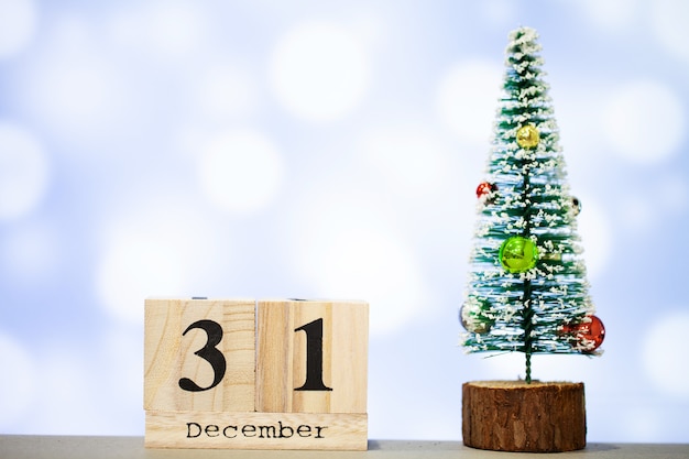 31 december and christmas decoration on blue background