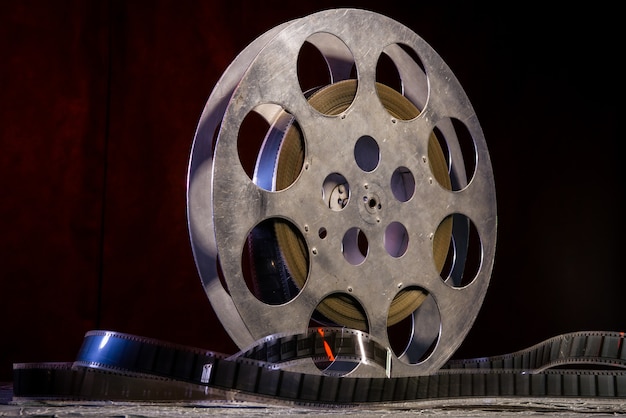 35 mm film reel with dramatic lighting on a dark