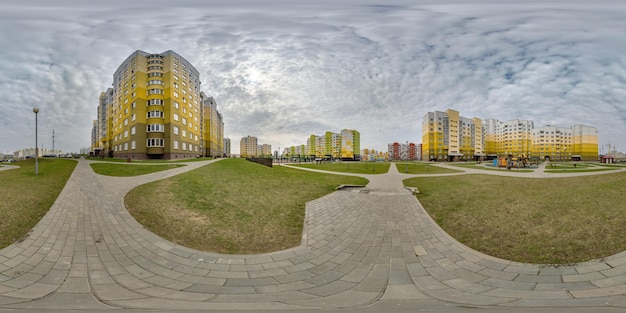 360 hdri panorama view with skyscrapers in new modern residential complex with highrise buildings in townwith overcast sky in equirectangular spherical projection ready AR VR virtual reality content