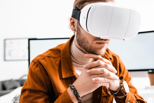 3d artist using virtual reality headset in office