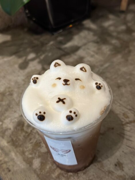 Photo 3d coffee cup of foamy coffee with teddy bears on it