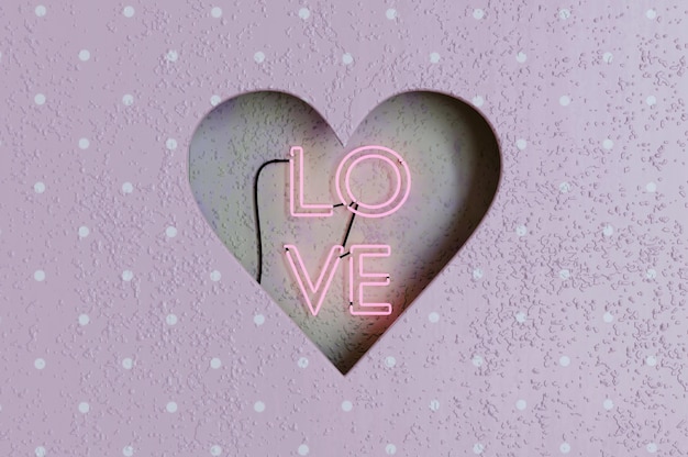 Photo 3d illustration . hole heart shaped inside retro neon love sign on cement wall . concept happy valentine's day.