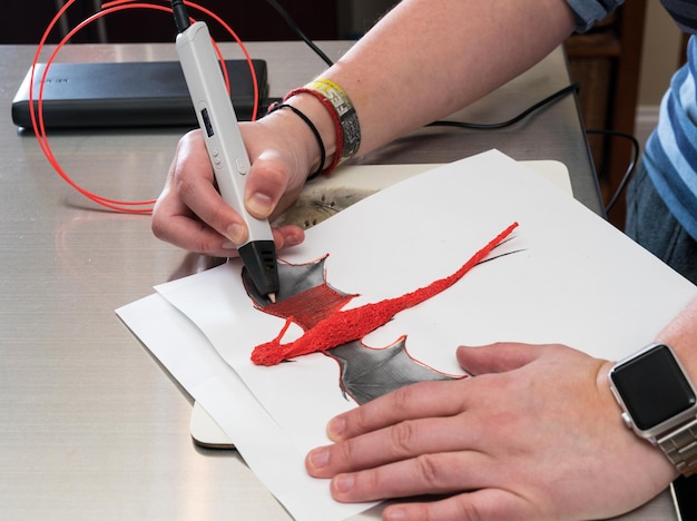 3D printing pen creating a dragon shape