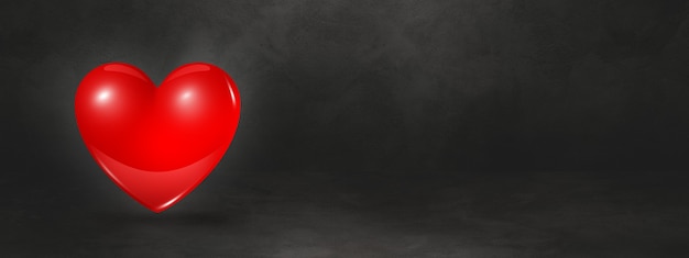 3D red heart isolated on a black studio banner. 3D illustration