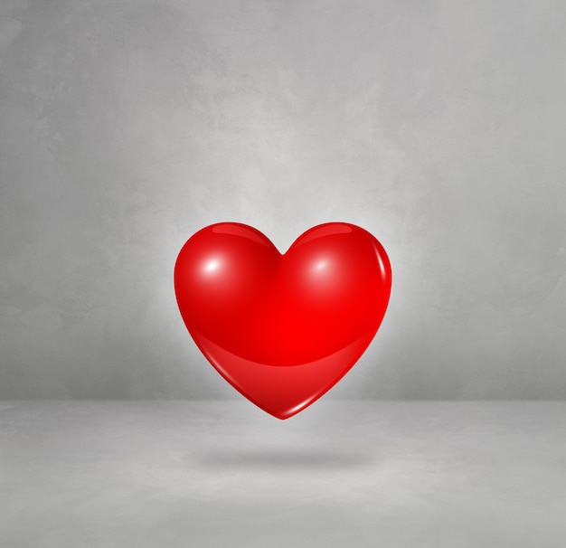 3D red heart isolated on a concrete studio background. 3D illustration