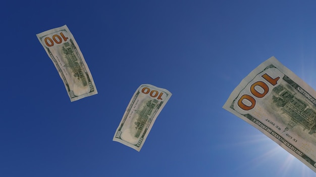 3d render. Falling 100 dollar bills. On the blue sky background