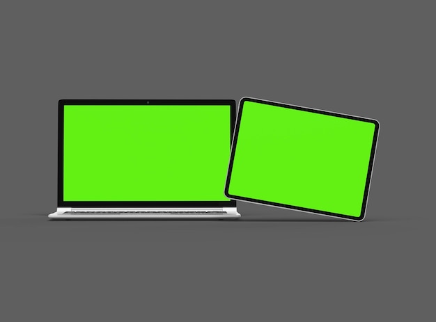 3d render of laptop and tablet with green screen on a dark background