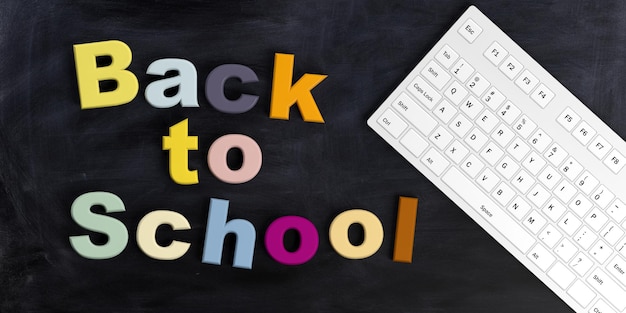 Photo 3d rendering back to school and a keyboard on a black chalkboard