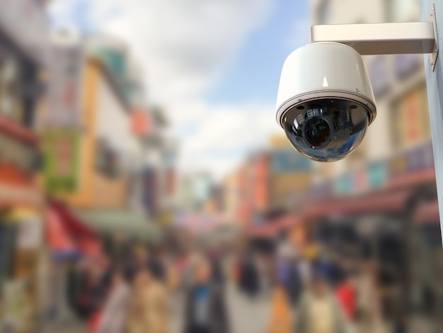 3D-rendering beveiligingscamera of cctv-camera met stadsgezicht achtergrond