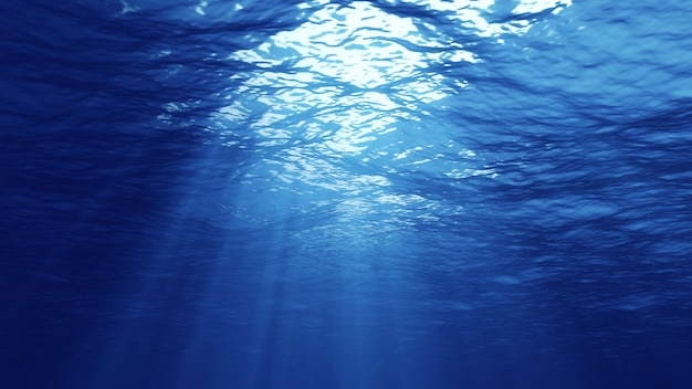 3D rendering of rays of sunlight shining from above penetrating deep clear blue water