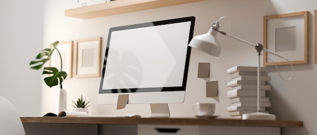 3D rendering, view through glass wall of home office room with computer, supplies, and decorations on the table