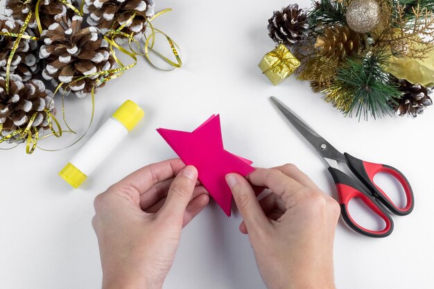 3D star made of colored paper. Step-by-step photo instruction. DIY concept. Children's Christmas and New Year's crafts. Step 6.