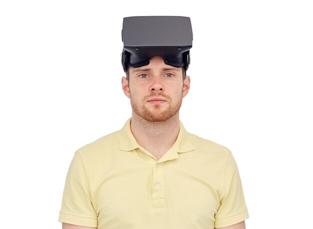 3d technology, virtual reality, entertainment and people concept - young man with virtual reality headset or 3d glasses