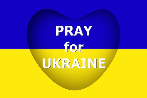 Photo 3d text of pray for ukraine on blue and yellow stripes with heart shaped ukrainian flag