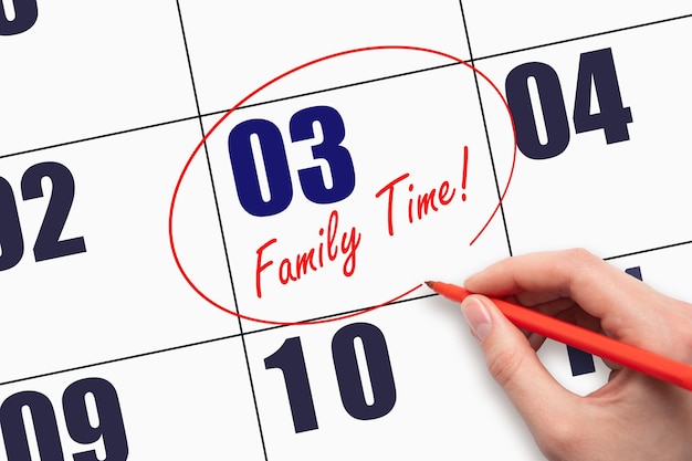 3rd day of the month Hand writing text FAMILY TIME and circling the calendar date