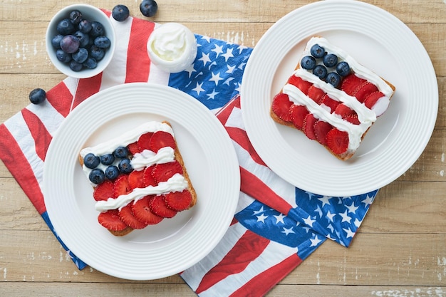 4th of July American Independence Day food American flag sandwich with strawberries blueberries whipped sweet cream soft cheese on toast bread Independence or Patriotic Day breakfast idea Mock up