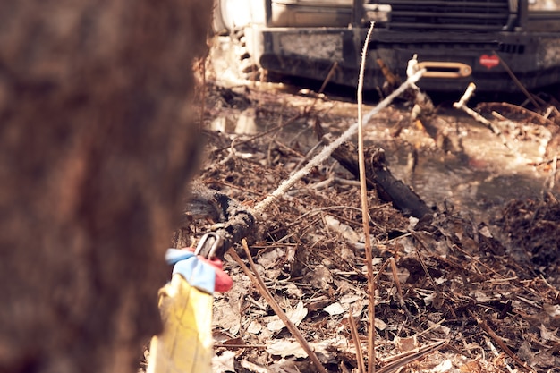 4x4 SUV pulls itself out of the trap with a winch caught on a tree. Extreme off-road racing