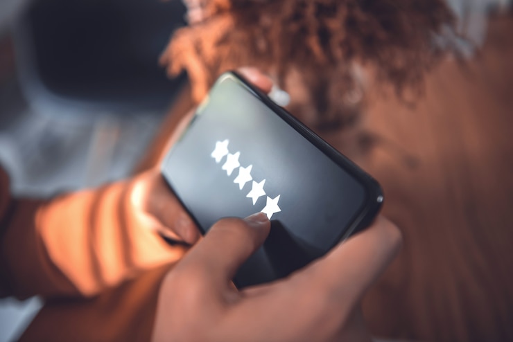 5 star rating or review in survey, poll, Customer woman hands holding smart phone Rate your experience, giving positive feedback,  questionnaire or customer satisfaction research.