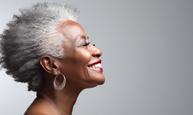 65 years old black woman grey background