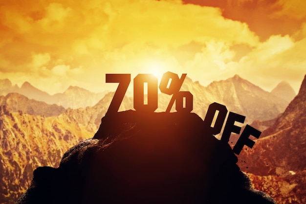 70% off writing on a mountain peak.