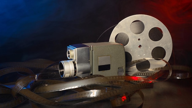 8 mm movie camera with a reel of film in blue and red
smoke