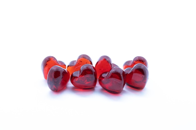 Photo 8 red glass hearts on white background